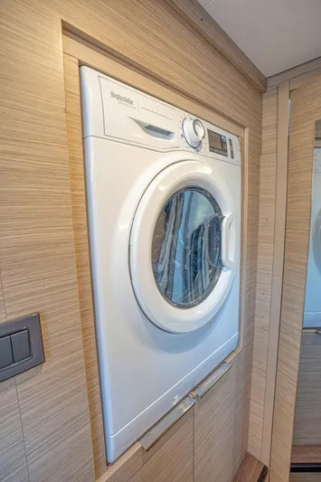 Sogno Yacht Photos Pics 2024 Lagoon 46 yacht interior with built-in washing machine.