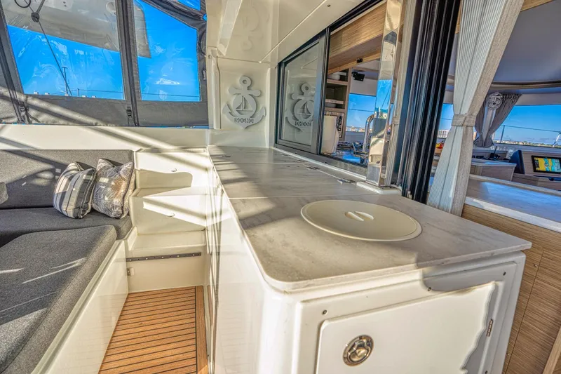 Sogno Yacht Photos Pics 2024 Lagoon 46 yacht interior with modern seating and sleek design.