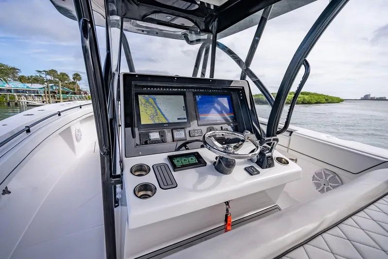  Yacht Photos Pics 2020 SeaHunter 35 Tournament boat console with navigation screens and steering wheel.