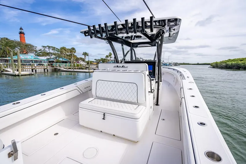  Yacht Photos Pics 2020 SeaHunter 35 Tournament boat on calm waters with lighthouse in background.
