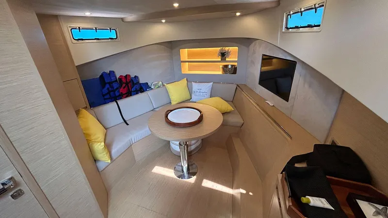  Yacht Photos Pics Luxurious interior of 2022 Solaris Power 44 yacht with cozy seating and modern amenities.