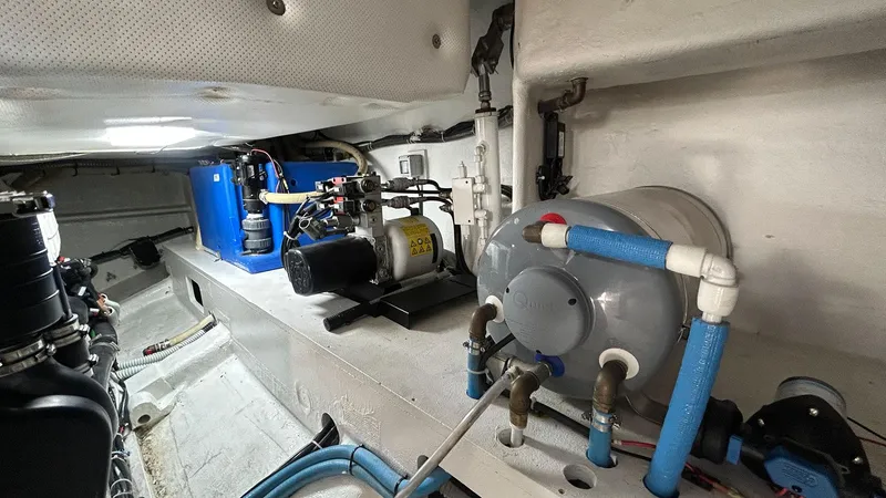  Yacht Photos Pics Engine room of 2022 Solaris Power 44 yacht with mechanical equipment and piping.