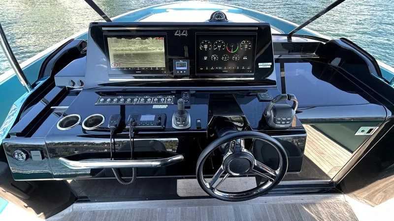  Yacht Photos Pics Helm of 2022 Solaris Power 44 yacht with modern navigation controls and sleek design.