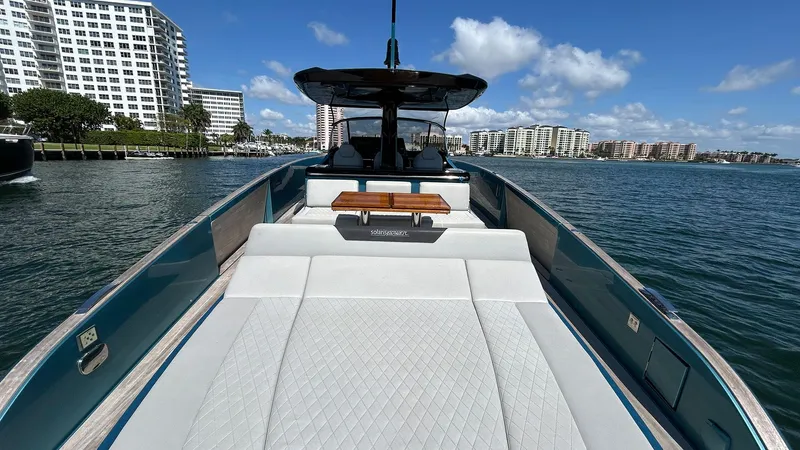  Yacht Photos Pics 2022 Solaris Power 44 yacht on water, featuring spacious deck and modern design.