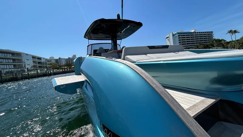  Yacht Photos Pics 2022 Solaris Power 44 yacht on water, modern design, sunny day, urban backdrop.