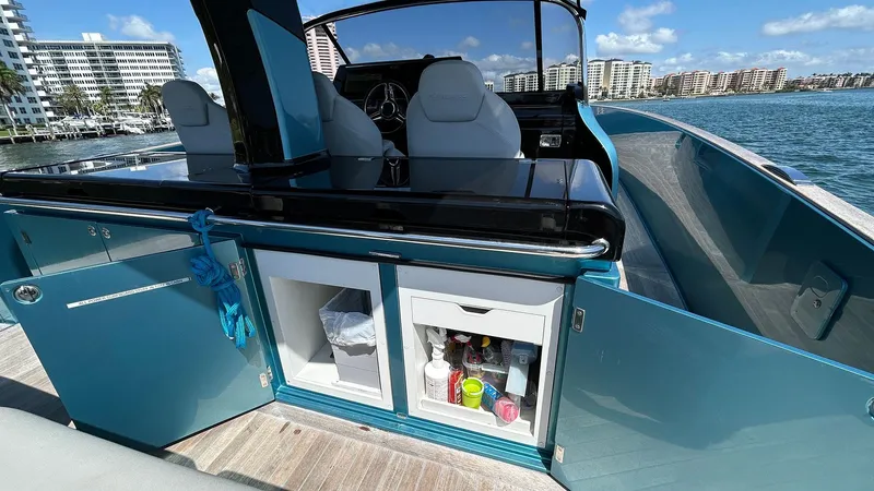  Yacht Photos Pics 2022 Solaris Power 44 yacht interior with open storage, ocean view, and modern seating.