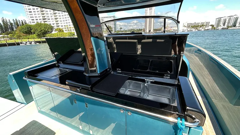  Yacht Photos Pics Luxury 2022 Solaris Power 44 yacht with sleek outdoor kitchen and stunning waterfront view.