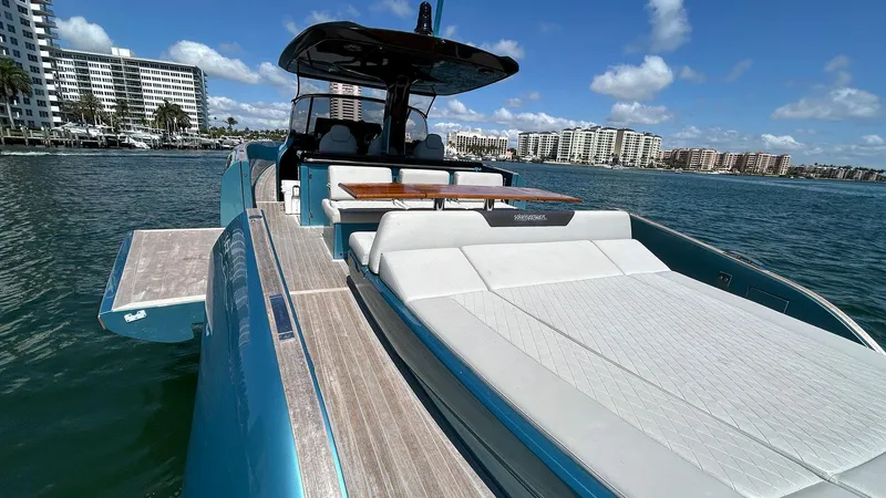  Yacht Photos Pics 2022 Solaris Power 44 yacht with sun deck, docked in a scenic marina.