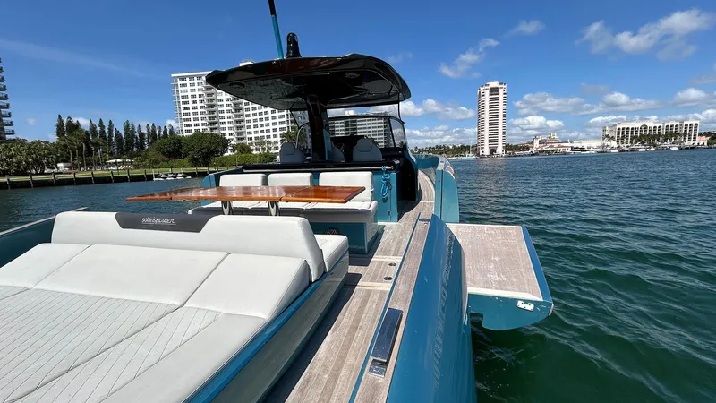  Yacht Photos Pics 2022 Solaris Power 44 yacht on water, featuring sleek design and luxurious seating.