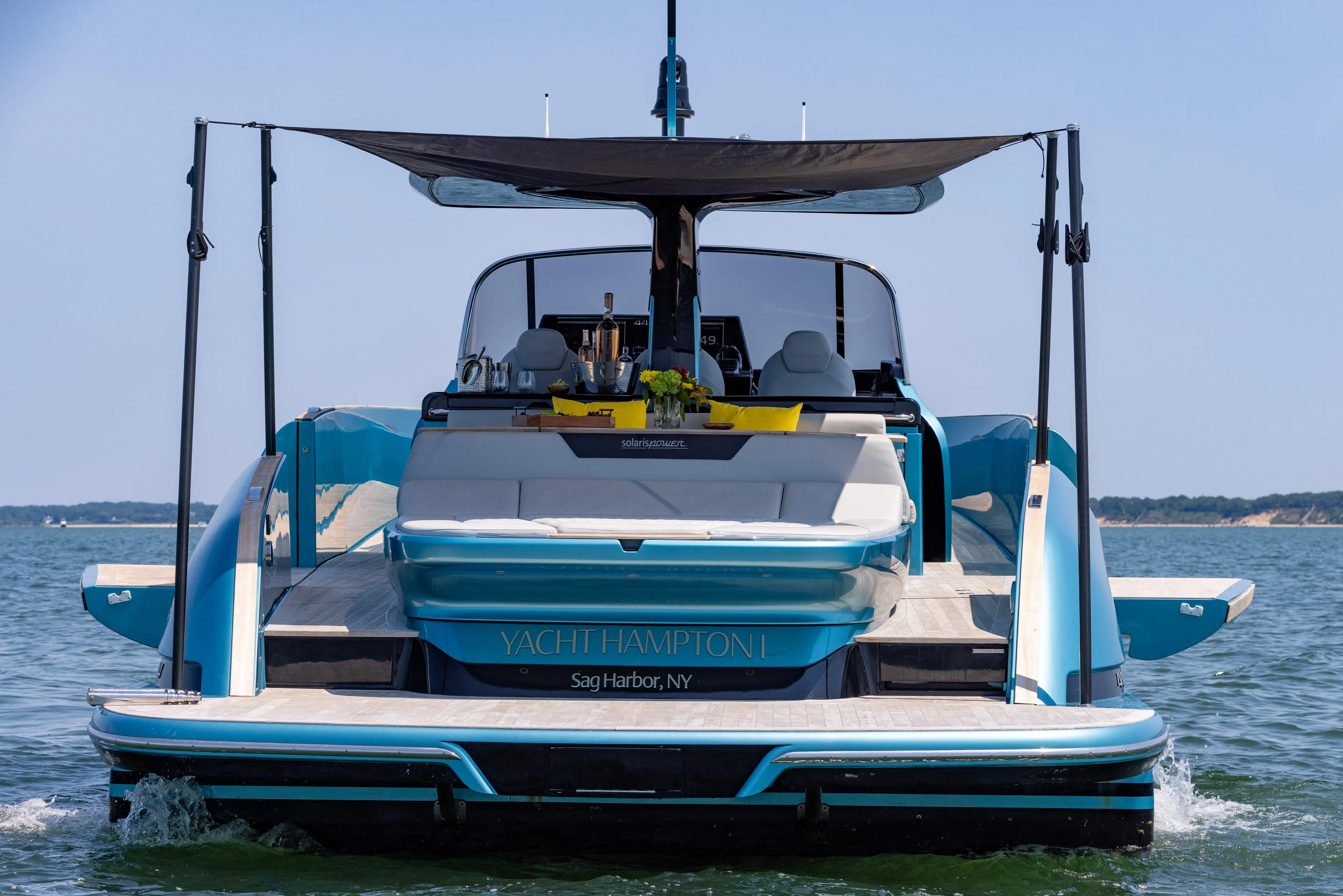  Yacht Photos Pics 2022 Solaris Power 44 yacht on water, featuring a luxurious deck and canopy.