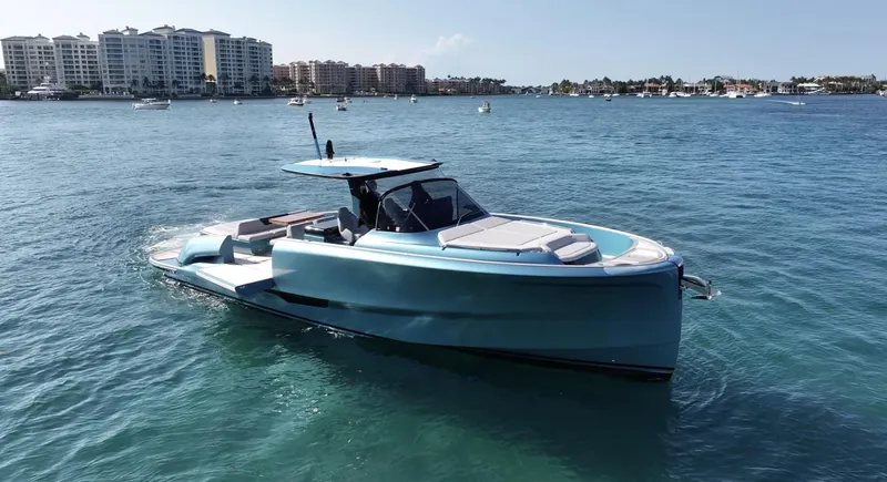  Yacht Photos Pics 2022 Solaris Power 44 yacht on calm water with cityscape background.