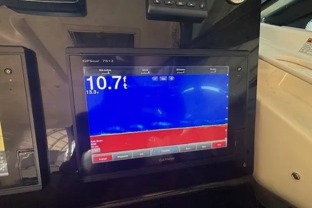 The Riddler Yacht Photos Pics Garmin GPS display on 2009 Tiara Yachts 3600 Open, showing depth of 10.7 feet.