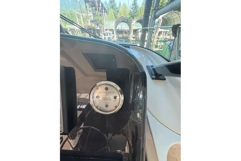 The Riddler Yacht Photos Pics Dashboard of a 2009 Tiara Yachts 3600 Open, featuring a generator gauge.