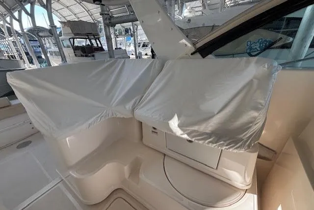The Riddler Yacht Photos Pics 2009 Tiara Yachts 3600 Open interior with covered seating and storage area.