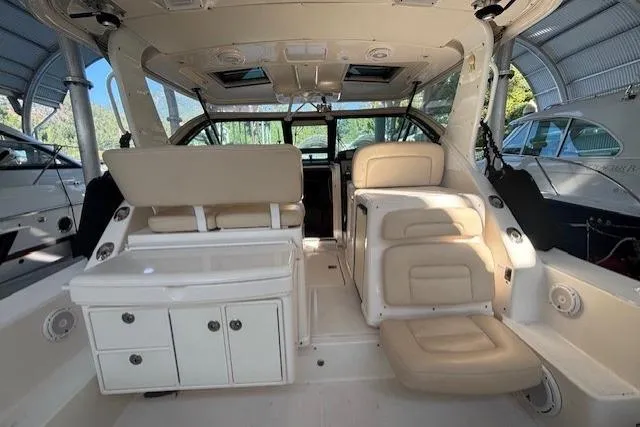 The Riddler Yacht Photos Pics 2009 Tiara Yachts 3600 Open interior with beige seating and white cabinetry.