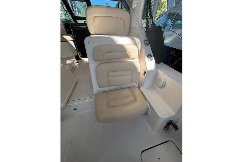 The Riddler Yacht Photos Pics 2009 Tiara Yachts 3600 Open interior seating with beige cushions and sleek design.