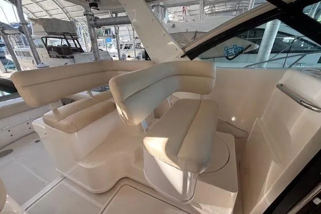The Riddler Yacht Photos Pics 2009 Tiara Yachts 3600 Open interior with beige seating and modern design.