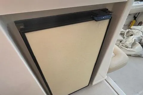 The Riddler Yacht Photos Pics 2009 Tiara Yachts 3600 Open interior with compact refrigerator.