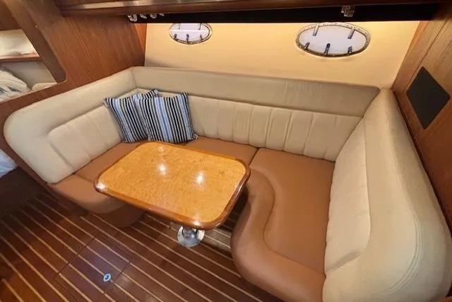 The Riddler Yacht Photos Pics Luxurious 2009 Tiara Yachts 3600 Open interior with elegant seating and wooden table.