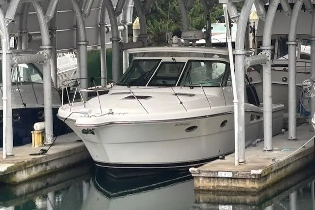 The Riddler Yacht Photos Pics 2009 Tiara Yachts 3600 Open docked under a covered marina.