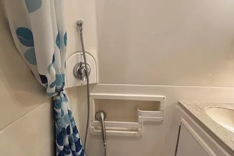 The Riddler Yacht Photos Pics 2009 Tiara Yachts 3600 Open bathroom with shower and polka dot curtain.