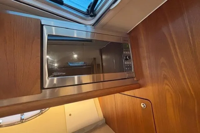The Riddler Yacht Photos Pics Microwave in 2009 Tiara Yachts 3600 Open, wooden interior detail.