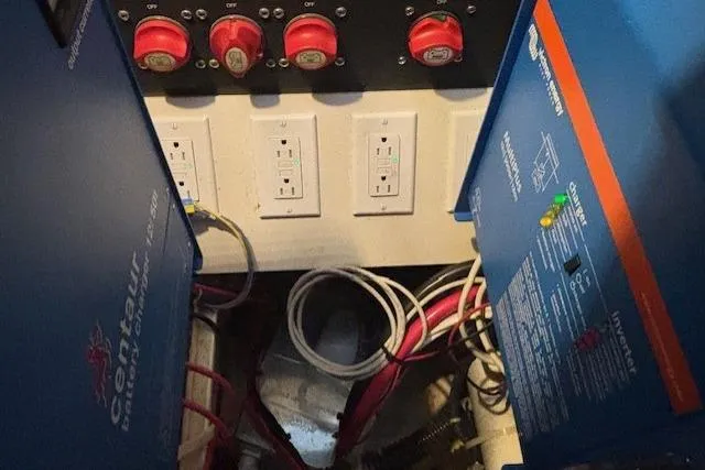 The Riddler Yacht Photos Pics Electrical system of a 2009 Tiara Yachts 3600 Open, featuring circuit breakers and wiring.