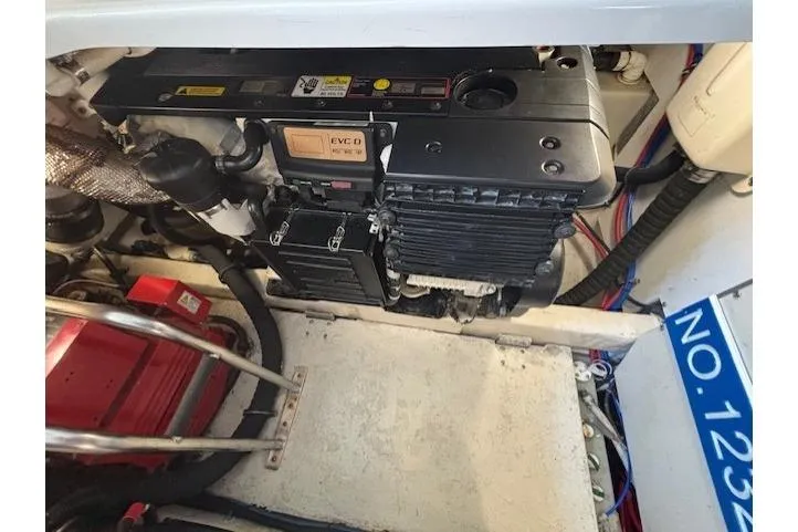 The Riddler Yacht Photos Pics Engine compartment of 2009 Tiara Yachts 3600 Open, showcasing mechanical components and wiring.