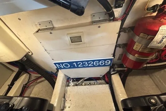 The Riddler Yacht Photos Pics Engine room of 2009 Tiara Yachts 3600 Open with fire extinguisher and serial number 1232669.