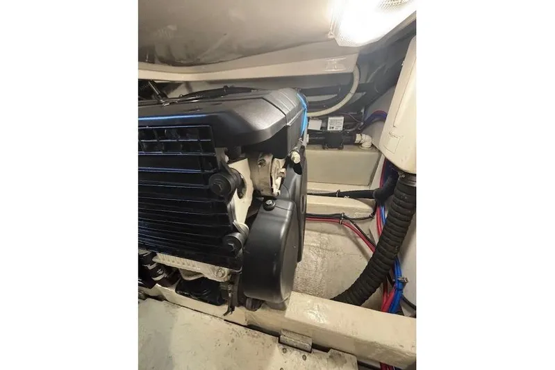 The Riddler Yacht Photos Pics Engine compartment of a 2009 Tiara Yachts 3600 Open, showcasing mechanical components.