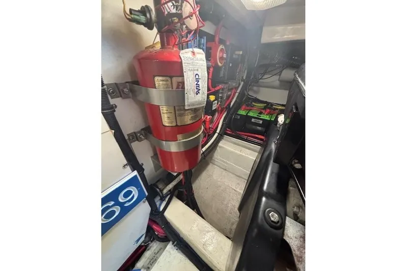 The Riddler Yacht Photos Pics Engine room of 2009 Tiara Yachts 3600 Open with fire extinguisher and battery.
