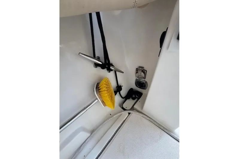 The Riddler Yacht Photos Pics 2009 Tiara Yachts 3600 Open deck with cleaning brush and mooring cleat.