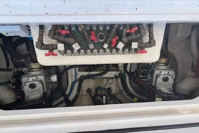 The Riddler Yacht Photos Pics Engine compartment of 2009 Tiara Yachts 3600 Open, showcasing mechanical components and wiring.