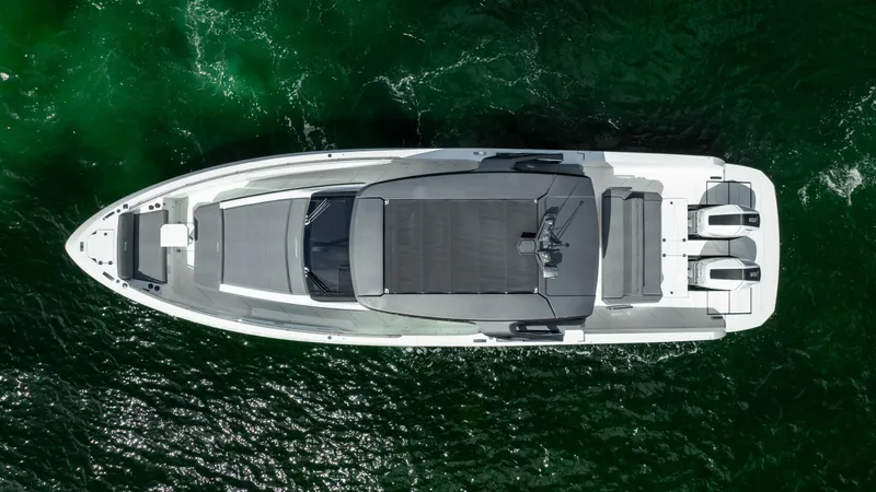  Yacht Photos Pics Aerial view of 2025 Limitless Seas XLV 45 yacht on green water.