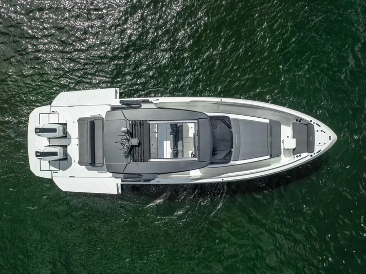  Yacht Photos Pics Aerial view of 2025 Limitless Seas XLV 45 yacht on green water.