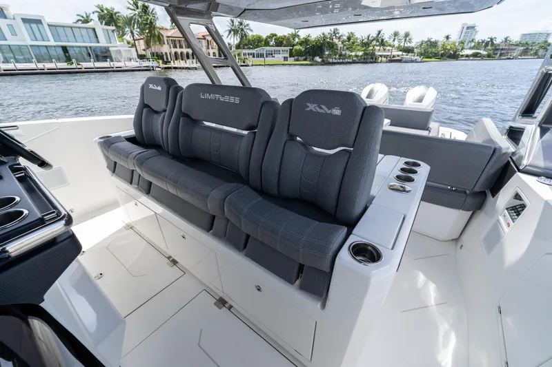  Yacht Photos Pics Luxury seating on Limitless Seas XLV 45 yacht, 2025 model, with waterfront view.