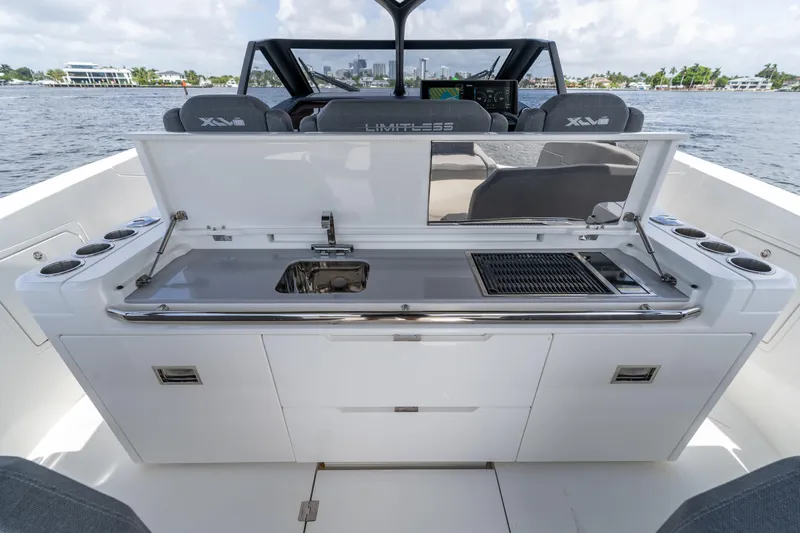  Yacht Photos Pics 2025 Limitless Seas XLV 45 yacht with outdoor kitchen and grill on deck.