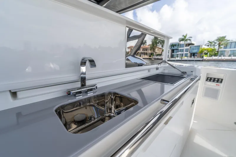  Yacht Photos Pics Luxurious Limitless Seas XLV 45 yacht kitchen, featuring sleek sink and modern appliances, 2025 model.