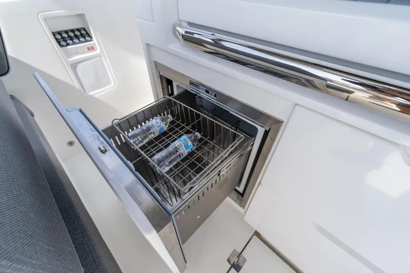  Yacht Photos Pics Luxury yacht Limitless Seas XLV 45, 2025 model, featuring a built-in cooler with water bottles.