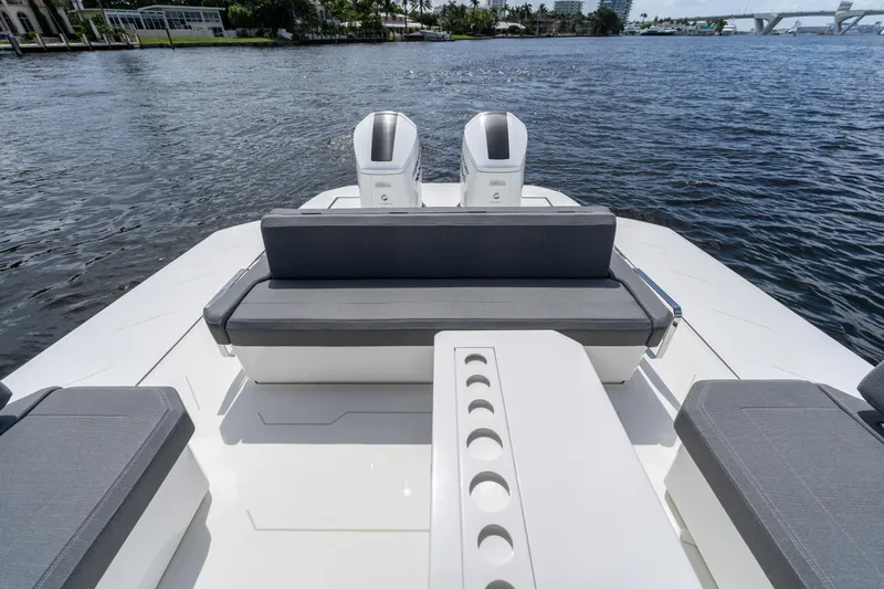  Yacht Photos Pics Luxury Limitless Seas XLV 45 boat, 2025 model, with sleek seating and dual engines on a serene waterway.