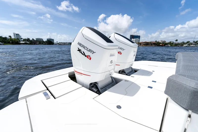  Yacht Photos Pics Limitless Seas XLV 45 boat with dual Mercury engines on a sunny day.