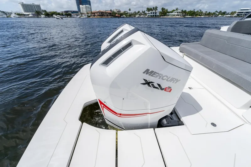  Yacht Photos Pics Limitless Seas XLV 45 boat with Mercury engines on a sunny waterfront.