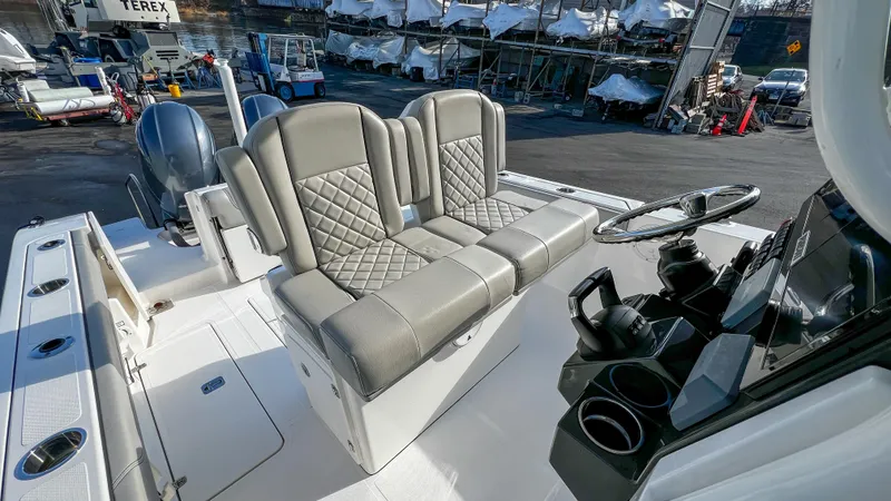  Yacht Photos Pics 2022 Pursuit S 268 boat interior with dual seats and steering console.