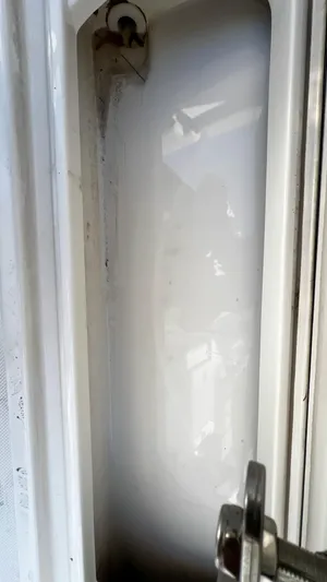  Yacht Photos Pics Close-up of a 2022 Pursuit S 268 boat compartment with latch detail.