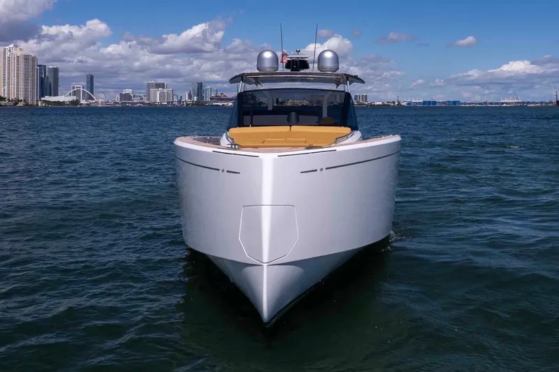 Seaduction Yacht Photos Pics 2023 Pardo Yachts 43 cruising in a scenic coastal city backdrop.