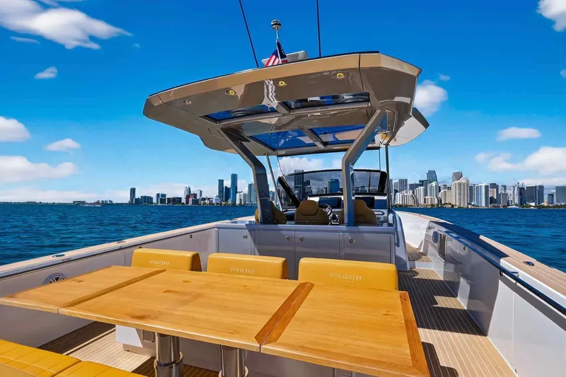 Seaduction Yacht Photos Pics 2023 Pardo Yachts 43 cruising with city skyline in the background.