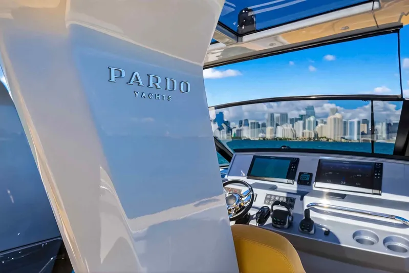 Seaduction Yacht Photos Pics Interior view of 2023 Pardo Yachts 43, showcasing helm and city skyline.