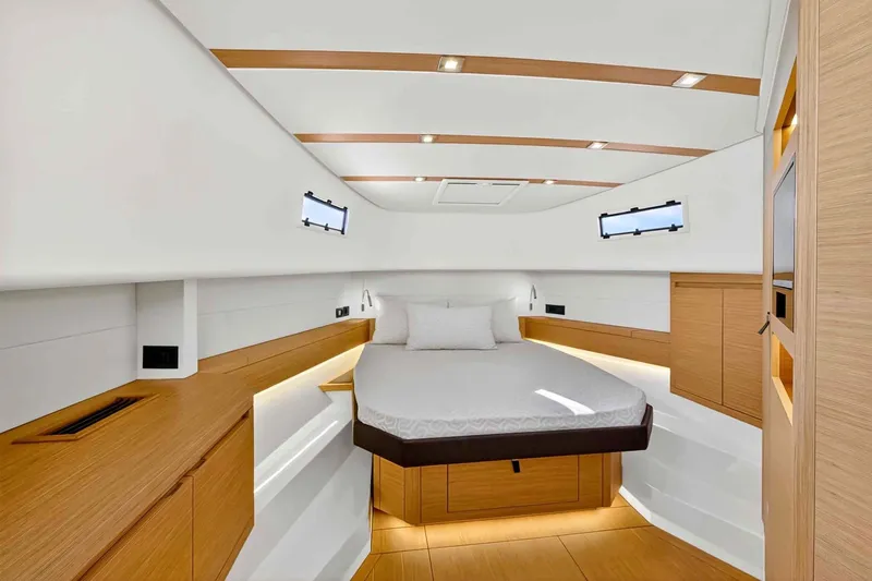 Seaduction Yacht Photos Pics Luxurious cabin interior of 2023 Pardo Yachts 43, featuring modern wood accents and ambient lighting.