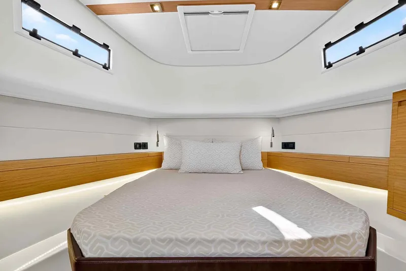 Seaduction Yacht Photos Pics Luxurious cabin interior of 2023 Pardo Yachts 43, featuring elegant bedding and modern design.