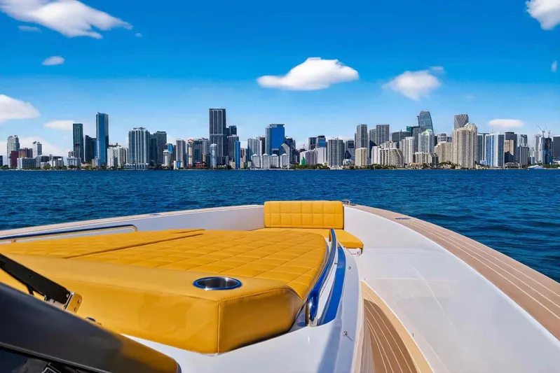 Seaduction Yacht Photos Pics 2023 Pardo Yachts 43 cruising with city skyline in the background.